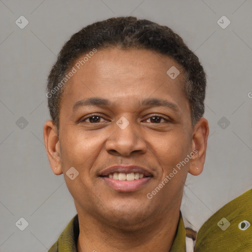 Joyful black young-adult male with short  brown hair and brown eyes