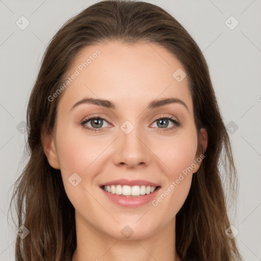 Joyful white young-adult female with long  brown hair and green eyes