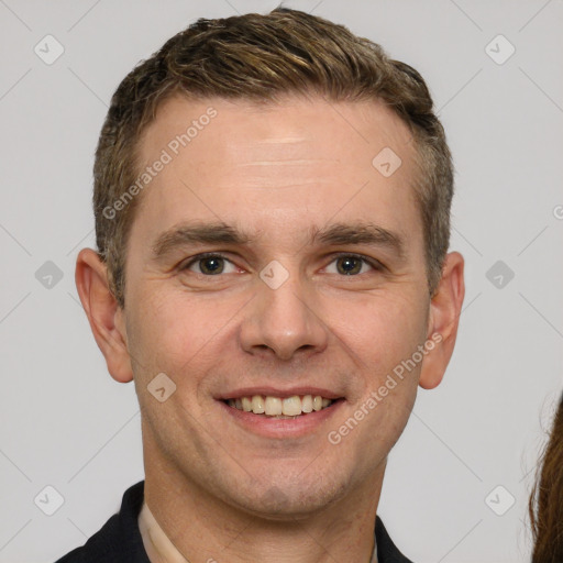 Joyful white young-adult male with short  brown hair and brown eyes