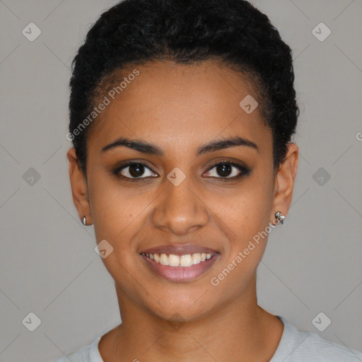 Joyful black young-adult female with short  black hair and brown eyes