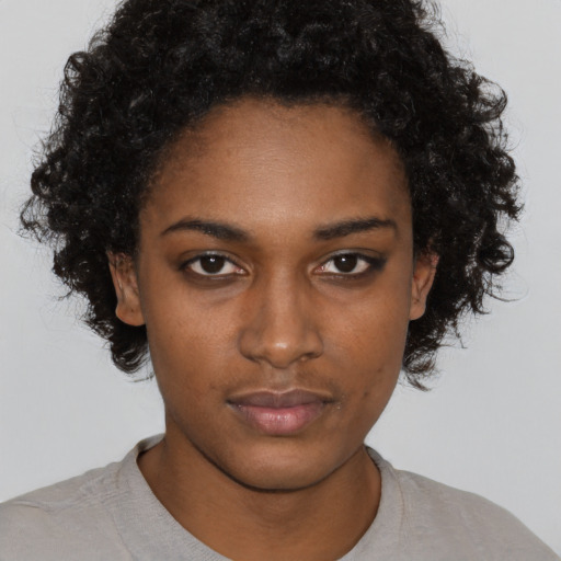 Neutral black young-adult female with short  brown hair and brown eyes