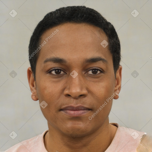 Joyful black young-adult male with short  black hair and brown eyes