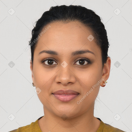 Joyful latino young-adult female with short  black hair and brown eyes