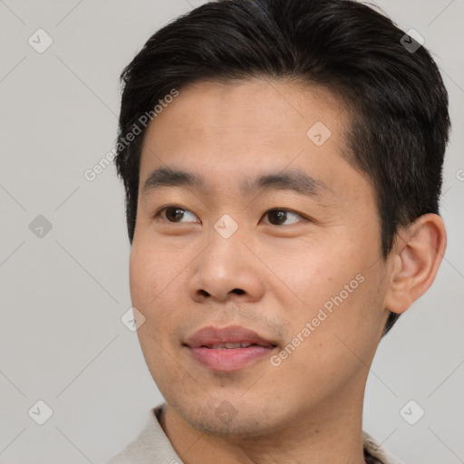 Joyful asian young-adult male with short  brown hair and brown eyes