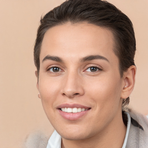 Joyful white young-adult female with short  brown hair and brown eyes