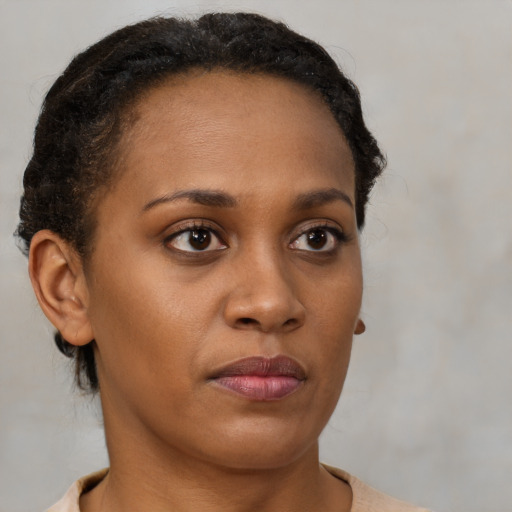 Neutral black young-adult female with short  brown hair and brown eyes