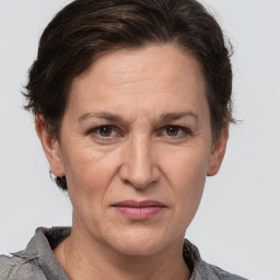 Joyful white adult female with short  brown hair and grey eyes