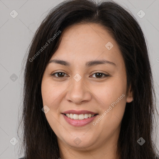 Joyful latino young-adult female with long  brown hair and brown eyes