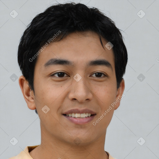 Joyful latino young-adult male with short  black hair and brown eyes