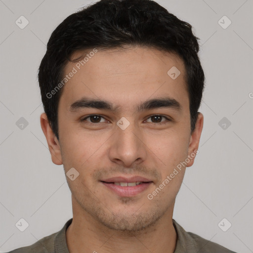 Joyful latino young-adult male with short  brown hair and brown eyes