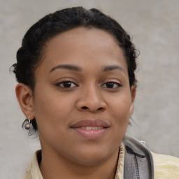 Joyful black young-adult female with medium  brown hair and brown eyes