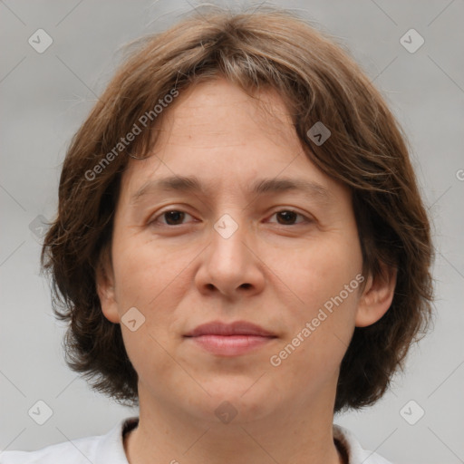 Joyful white adult female with medium  brown hair and brown eyes