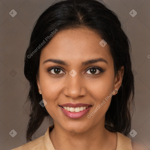 Joyful black young-adult female with medium  brown hair and brown eyes