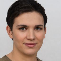 Joyful white young-adult female with short  brown hair and grey eyes