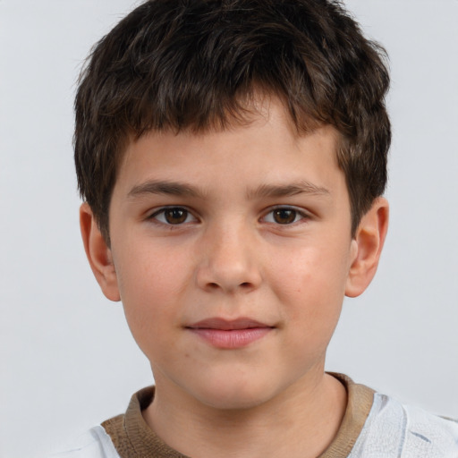 Joyful white child male with short  brown hair and brown eyes