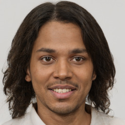 Joyful white young-adult male with medium  brown hair and brown eyes