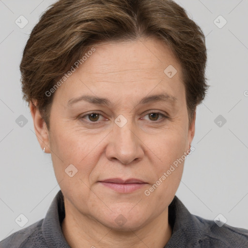 Joyful white adult female with short  brown hair and grey eyes