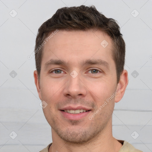 Joyful white young-adult male with short  brown hair and brown eyes