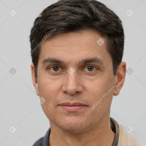 Joyful white adult male with short  brown hair and brown eyes