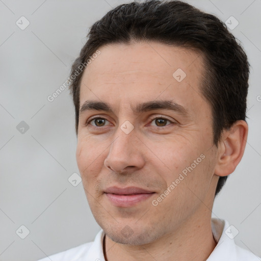 Joyful white adult male with short  brown hair and brown eyes