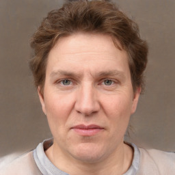 Joyful white adult female with short  brown hair and grey eyes