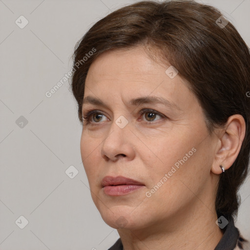 Joyful white adult female with medium  brown hair and grey eyes