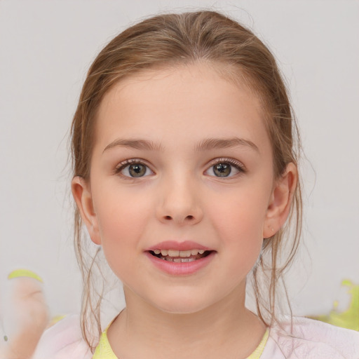 Joyful white child female with medium  brown hair and blue eyes