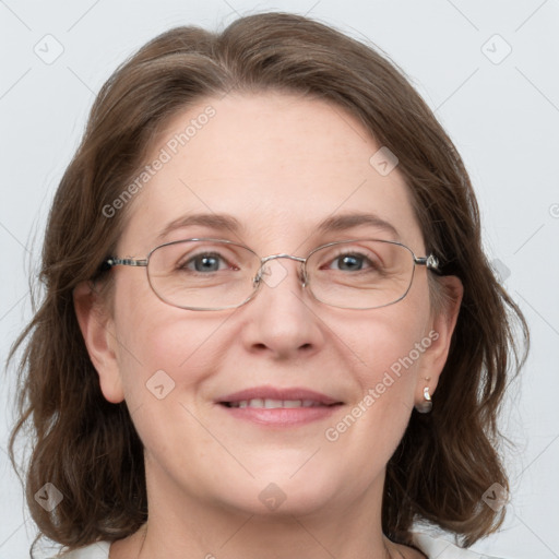 Joyful white adult female with medium  brown hair and grey eyes