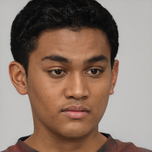Neutral latino young-adult male with short  brown hair and brown eyes