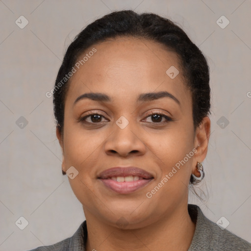 Joyful black young-adult female with medium  black hair and brown eyes