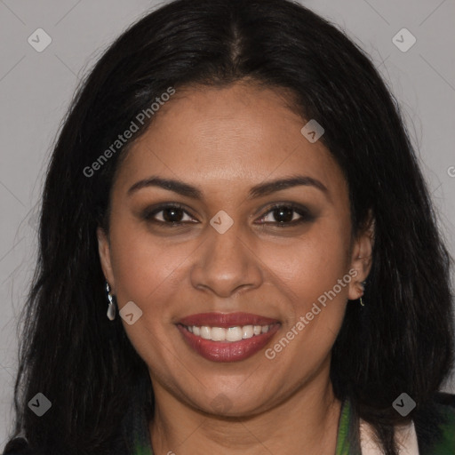 Joyful latino young-adult female with long  brown hair and brown eyes
