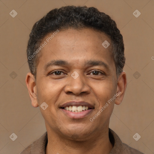 Joyful latino young-adult male with short  brown hair and brown eyes