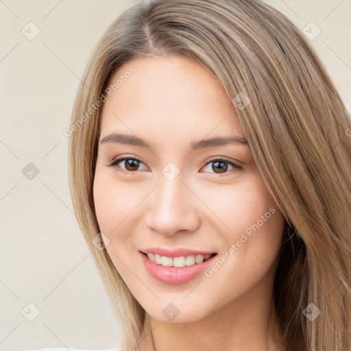 Joyful white young-adult female with long  brown hair and brown eyes