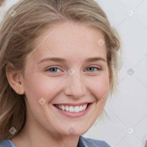 Joyful white young-adult female with medium  brown hair and blue eyes