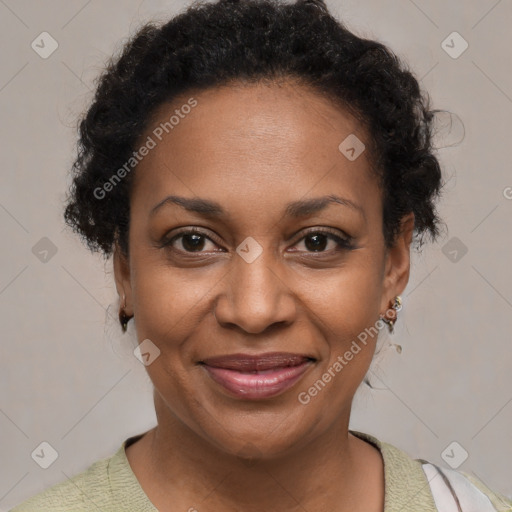 Joyful black adult female with short  brown hair and brown eyes