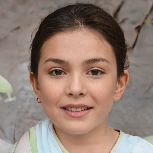 Joyful white child female with short  brown hair and brown eyes