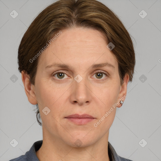 Joyful white adult female with short  brown hair and grey eyes