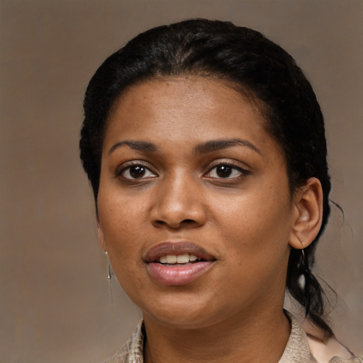Joyful black young-adult female with medium  black hair and brown eyes