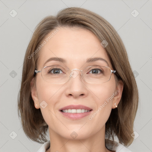 Joyful white adult female with medium  brown hair and grey eyes