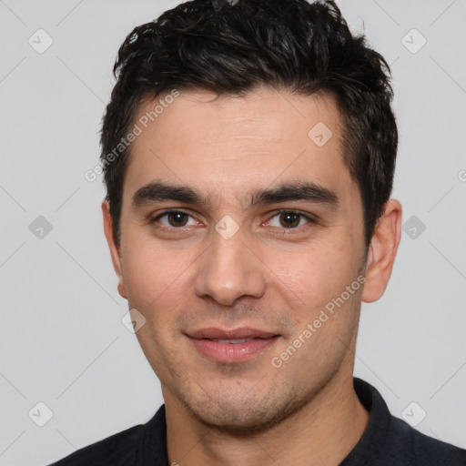 Joyful white young-adult male with short  black hair and brown eyes