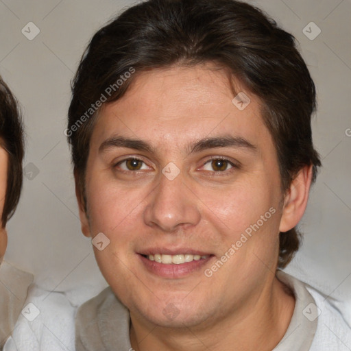 Joyful white adult male with short  brown hair and brown eyes