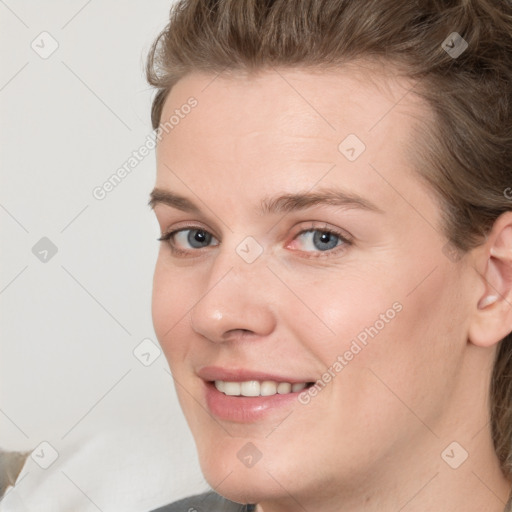 Joyful white young-adult female with medium  brown hair and blue eyes