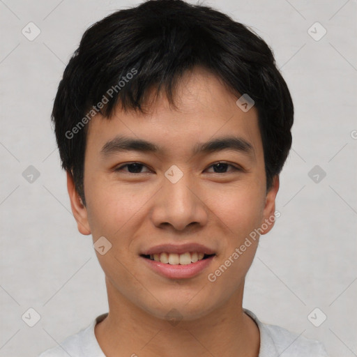 Joyful asian young-adult male with short  black hair and brown eyes