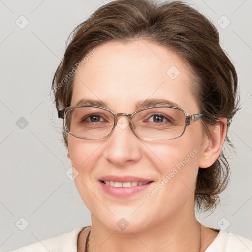 Joyful white adult female with medium  brown hair and blue eyes