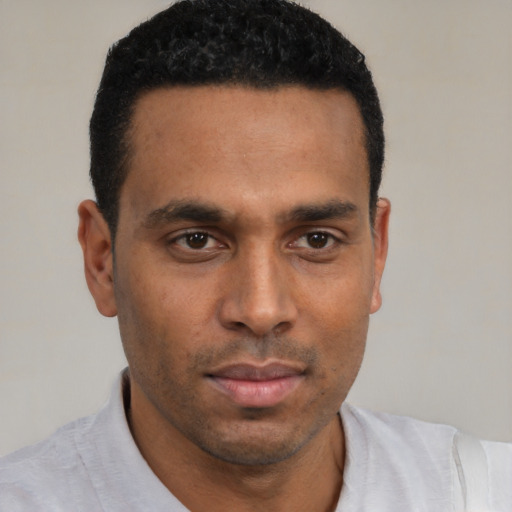 Neutral black young-adult male with short  black hair and brown eyes
