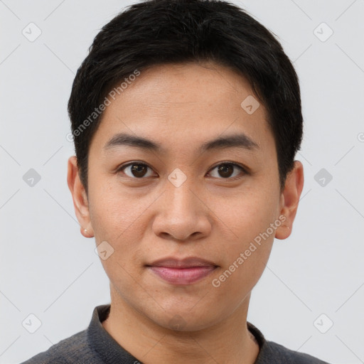 Joyful asian young-adult male with short  brown hair and brown eyes