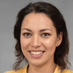 Joyful white young-adult female with medium  brown hair and brown eyes