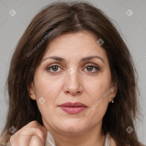 Joyful white adult female with long  brown hair and brown eyes