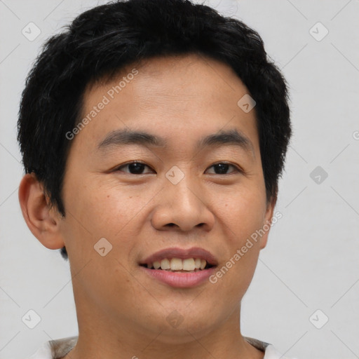 Joyful asian young-adult male with short  black hair and brown eyes