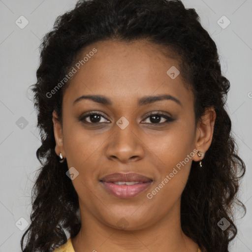 Joyful black young-adult female with long  brown hair and brown eyes